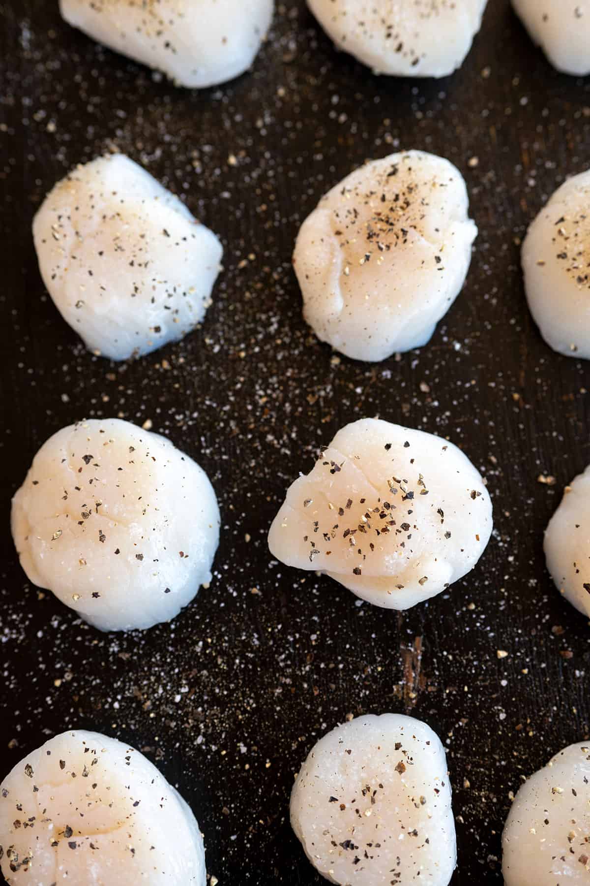 scallops seasoned with salt and pepper.