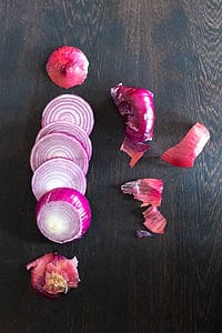Red onion sliced with roots and skin removed.