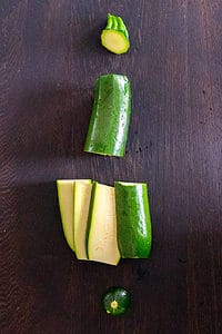 zucchini sliced with ends removed, cut in half and then cut into 4 vertical slices.