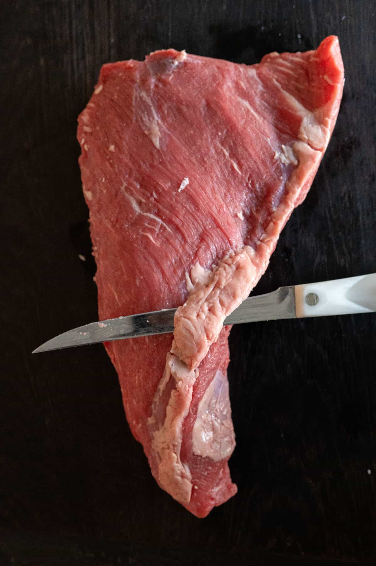 trimming fat from tri tip.