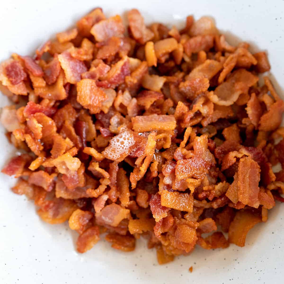 cooked crumbled bacon in a bowl.