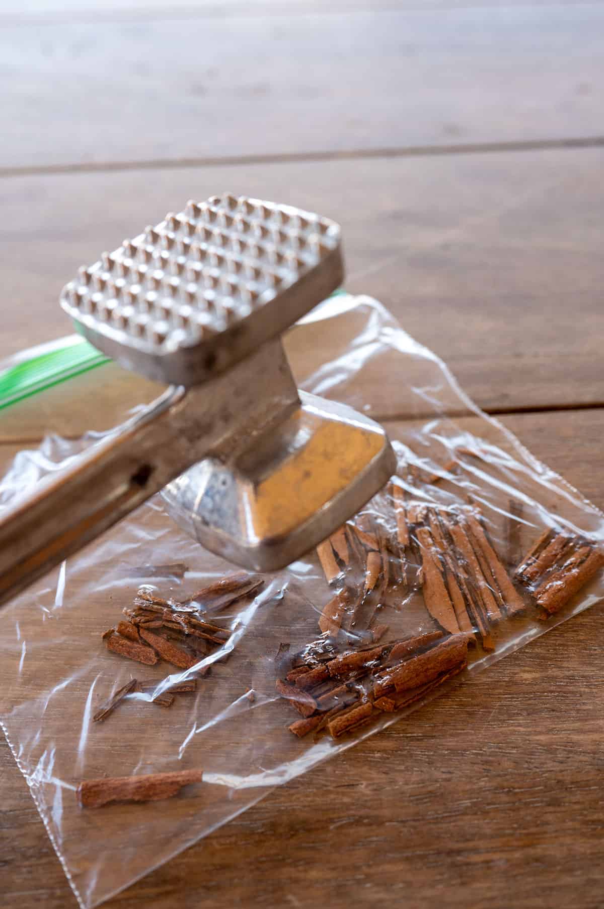 smashing cinnamon sticks in a baggie with a meat mallet.
