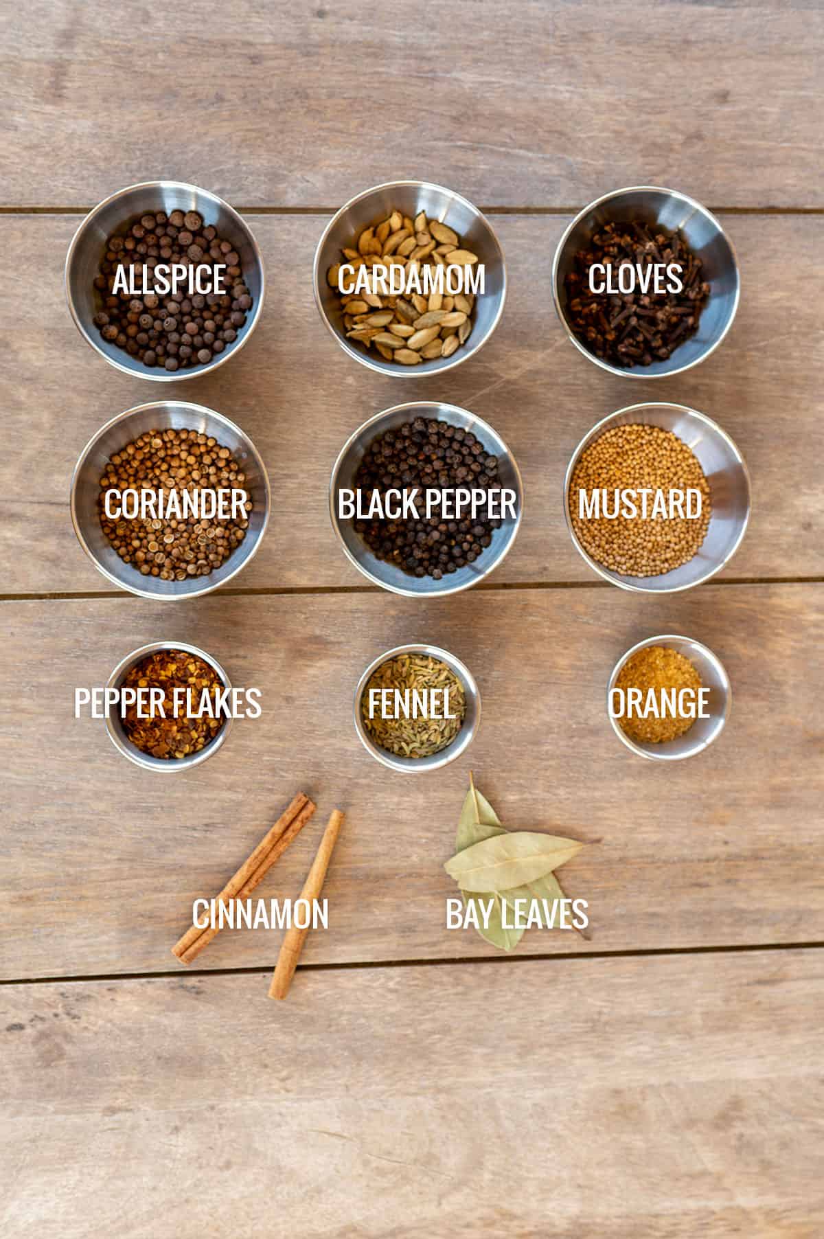pickling spice ingredients laid out on counter.