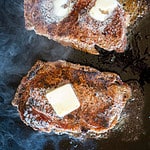 seared steaks topped with butter.