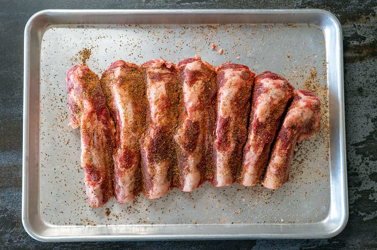 seasoned beef back ribs on pan.