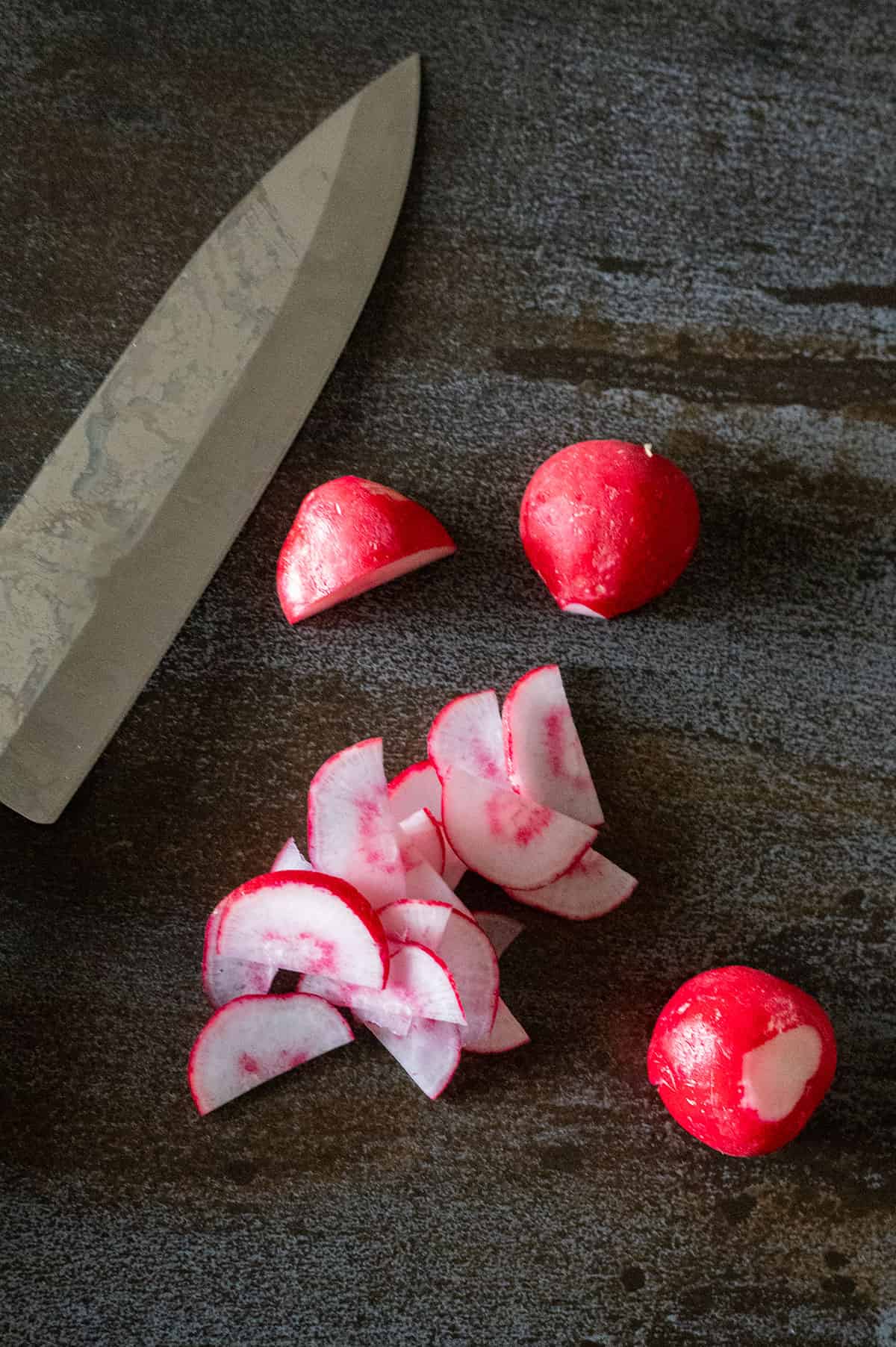 radish sliced in half and sliced thin.