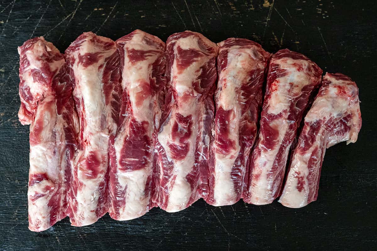 untrimmed, raw beef back ribs.