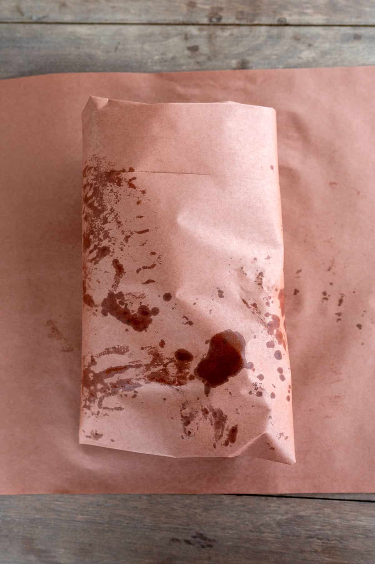 Brisket pastrami wrapped in butcher paper.