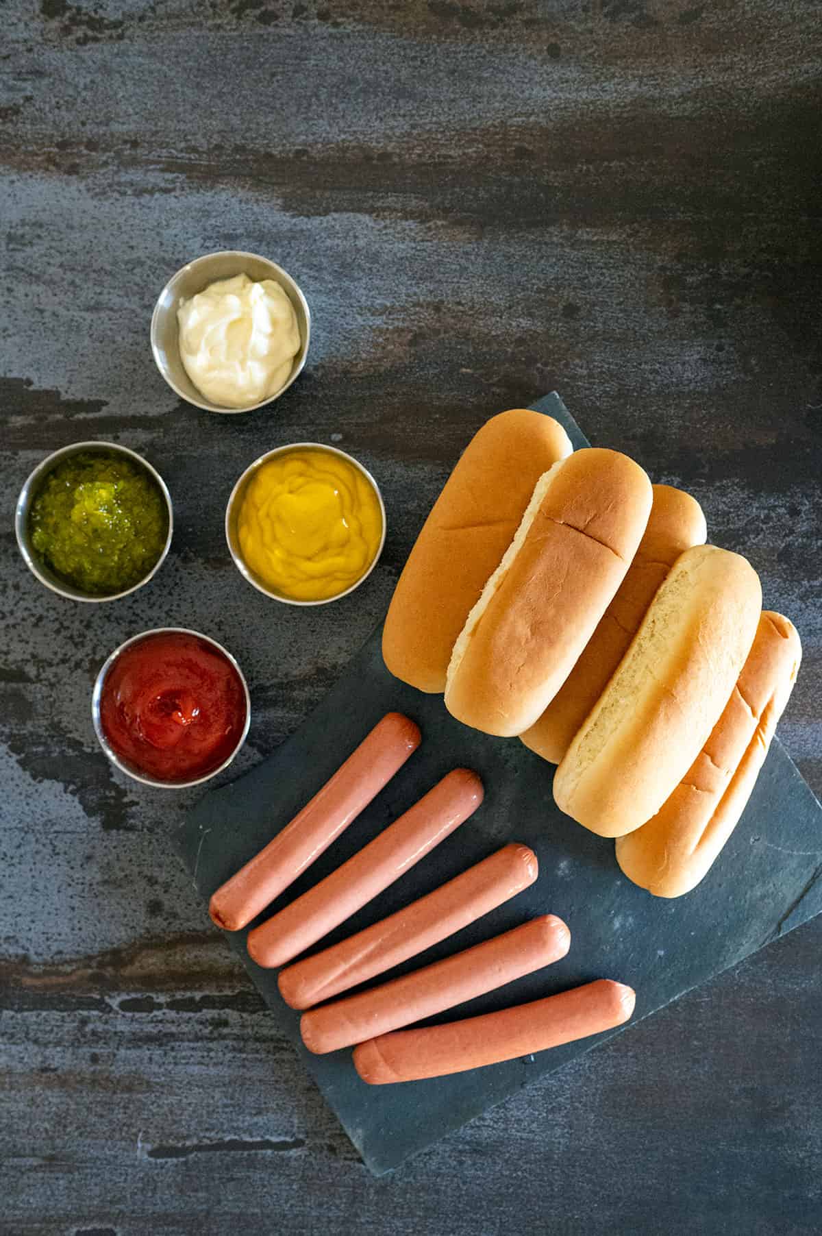 hot dogs, buns and condiments.