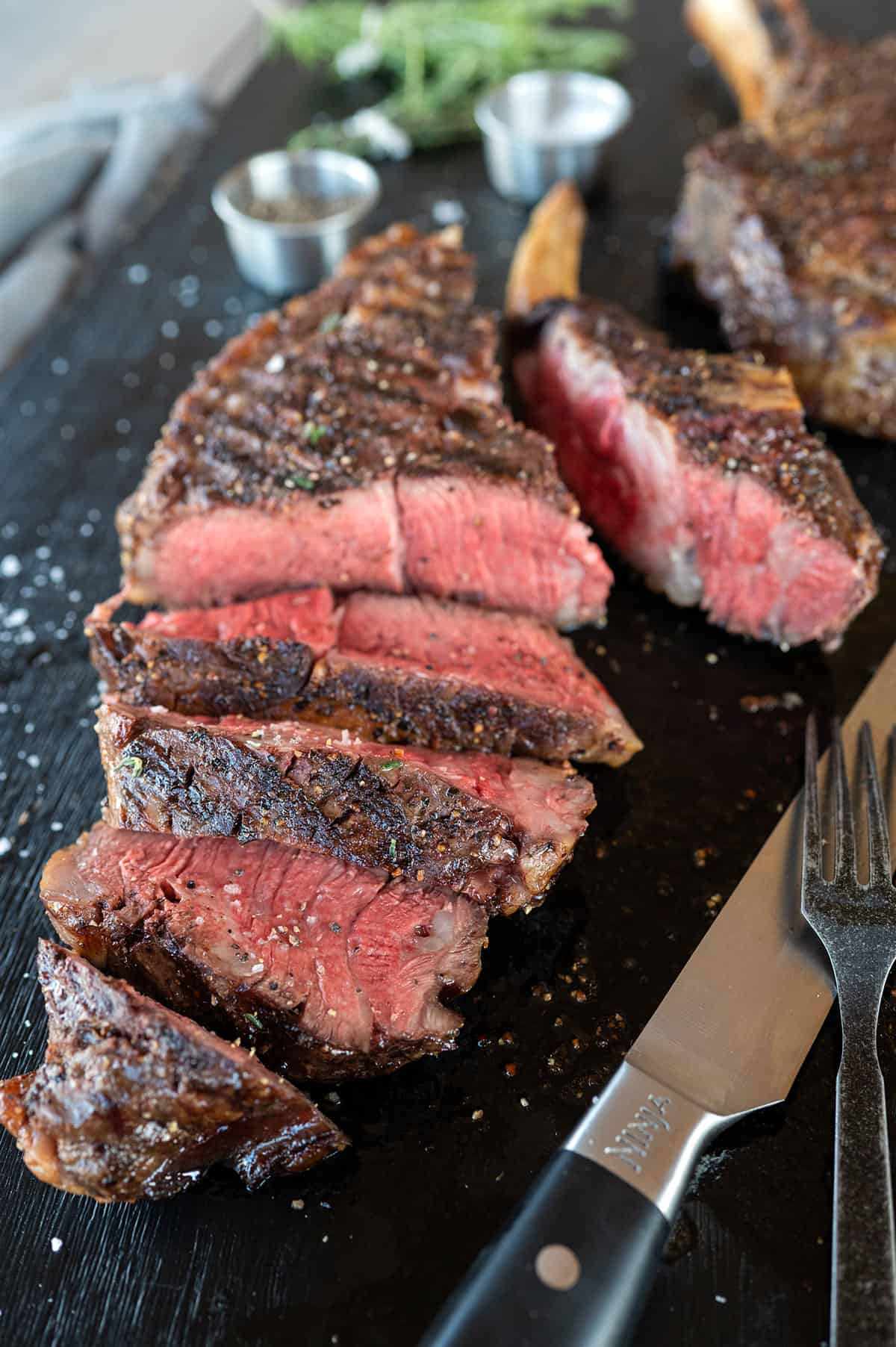 sliced cowboy ribeye steak.