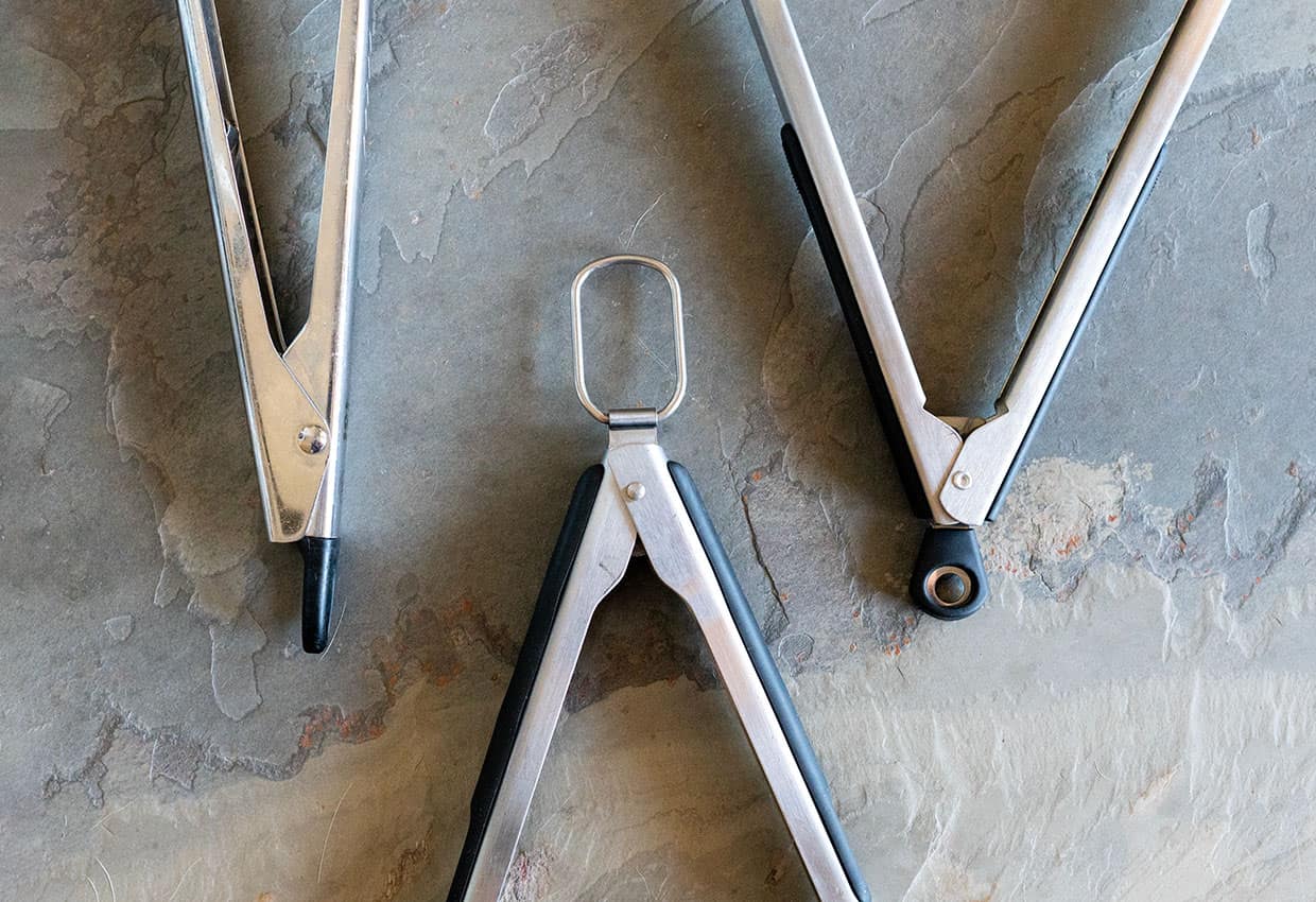 3 pair of grill tongs showing different lock styles. 