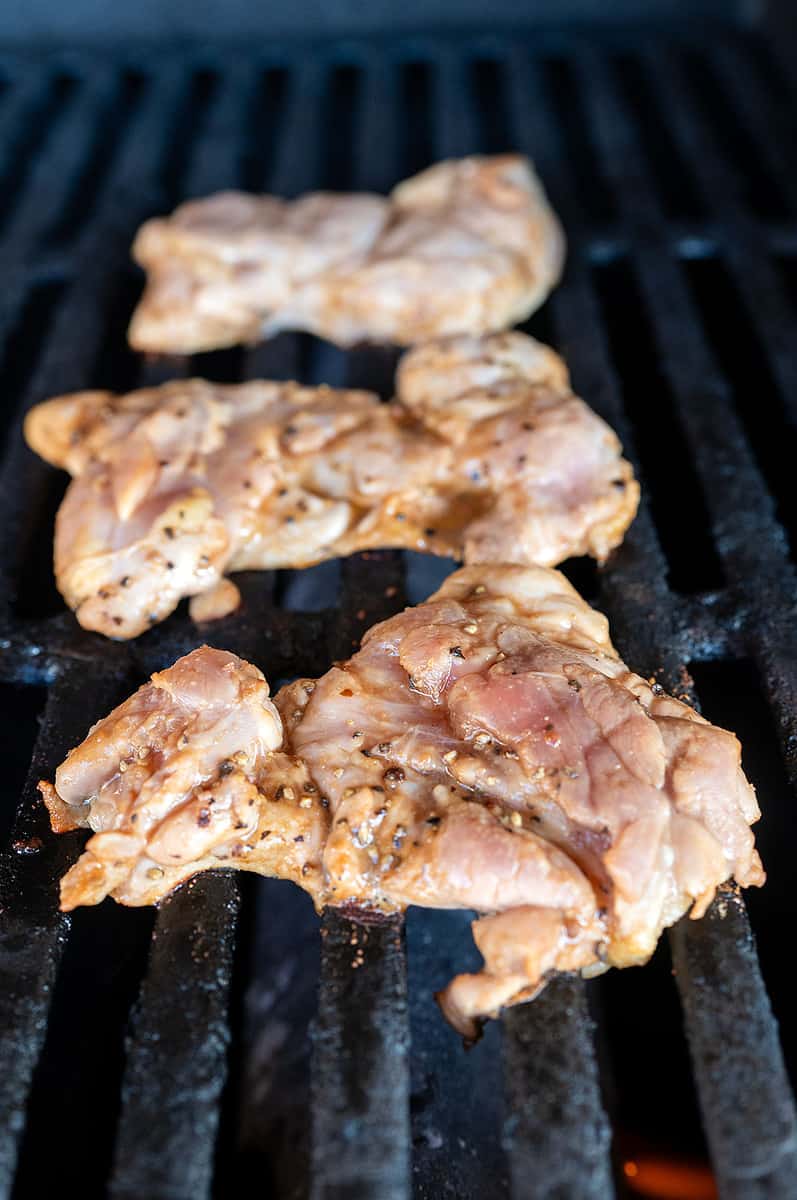 Chicken thighs on grill.