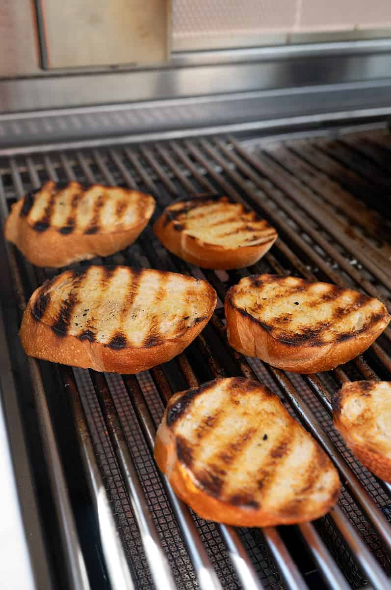 Grilling French bread slices.