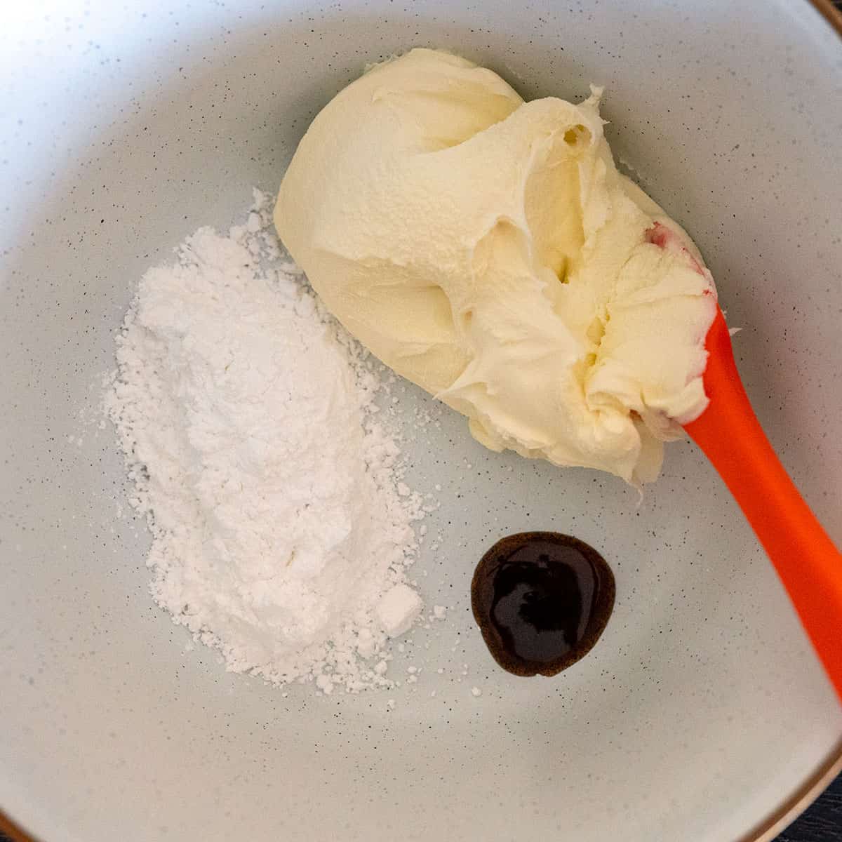 Bowl of mascarpone, powdered sugar and vanilla.