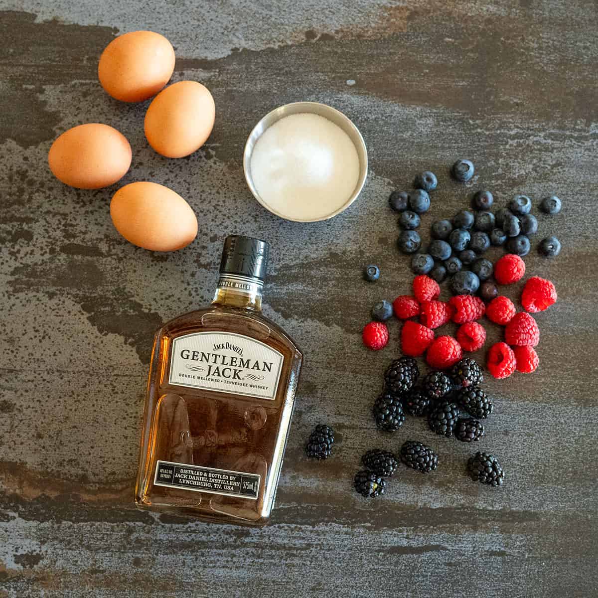 Sabayon ingredients: eggs, sugar, berries, whiskey.