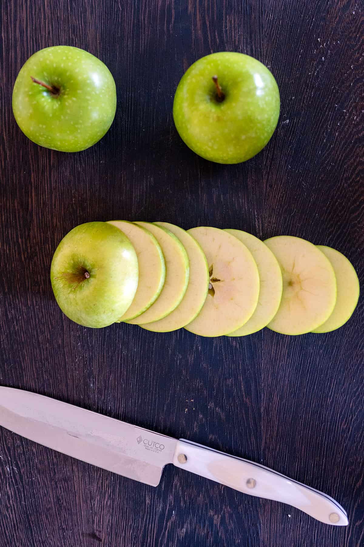 Green apple sliced into 1/8-inch thick slices.
