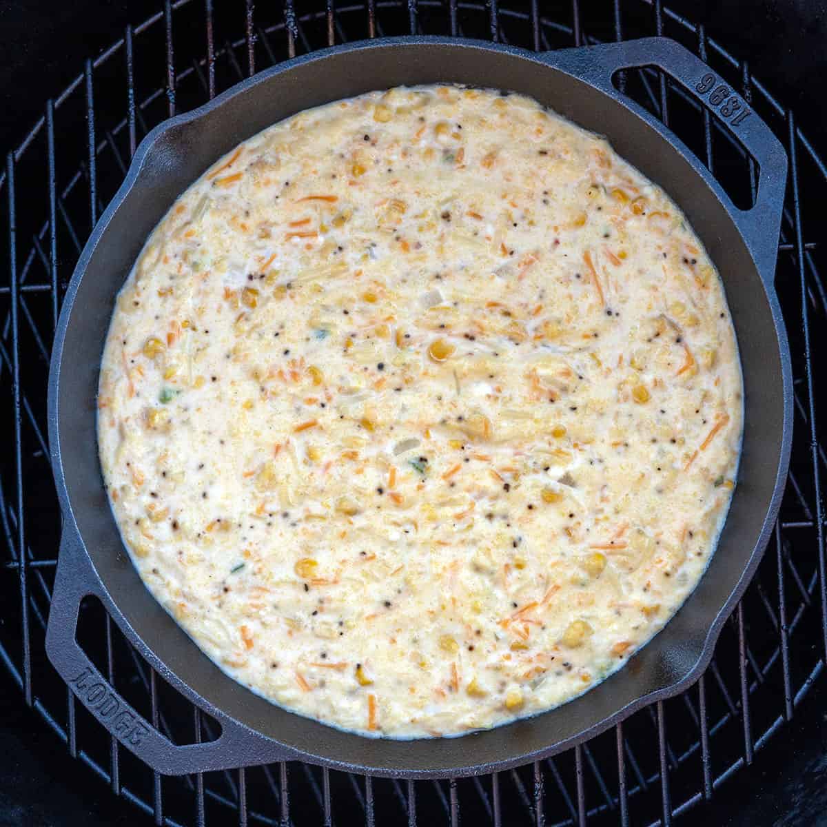 Corn pudding baking on grill.