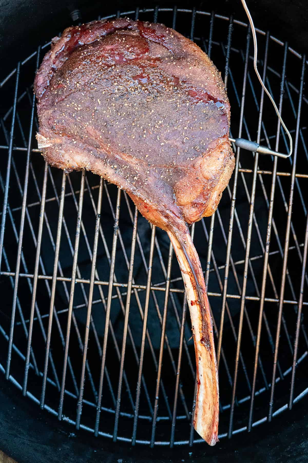 Tomahawk steak on grill once it's reached 110F.