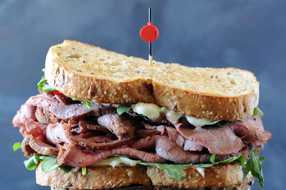 Cold roast beef sandwich with lettuce, tomato and mayo.