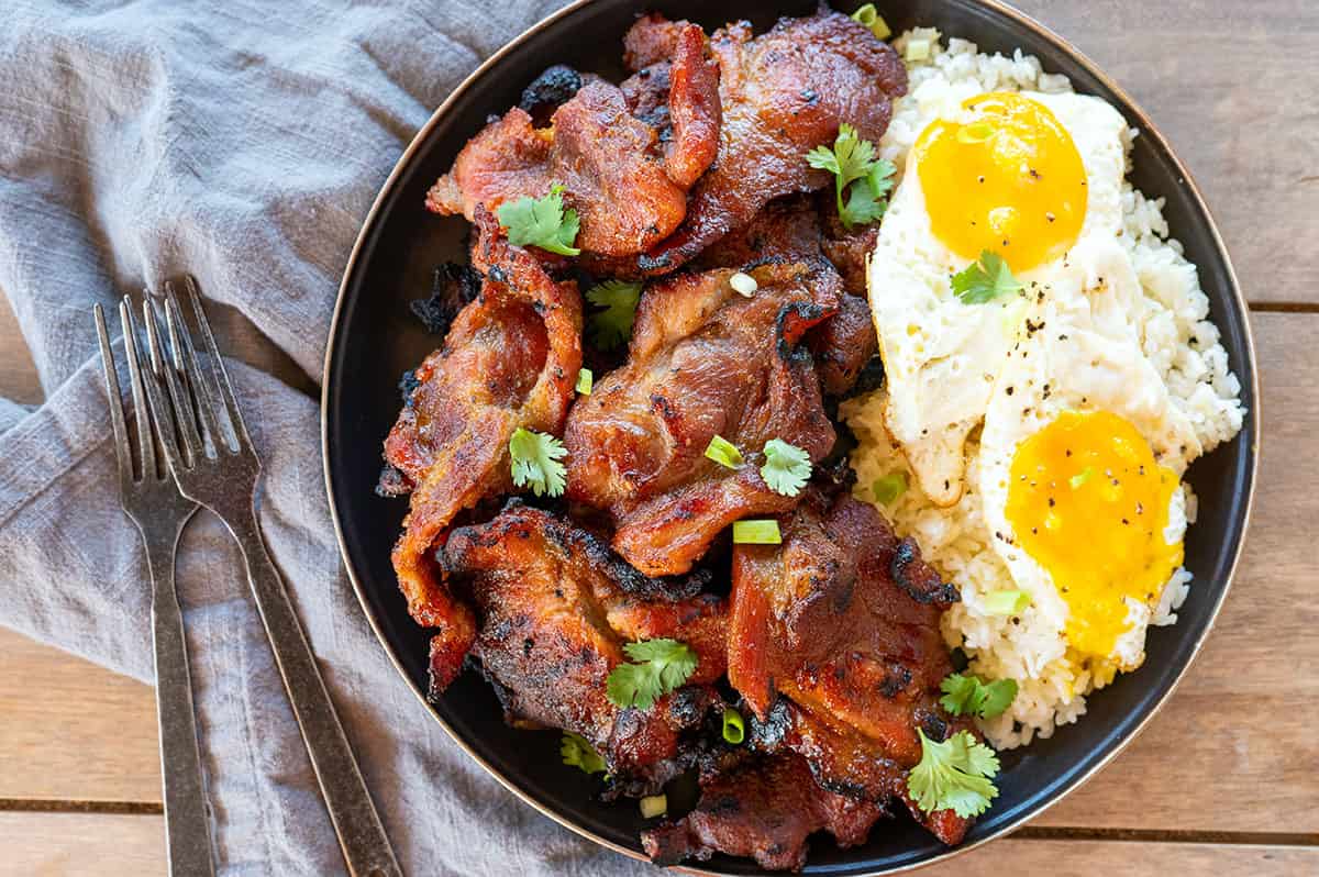 Plate of pork tocino with garlic fried rice and fried eggs.