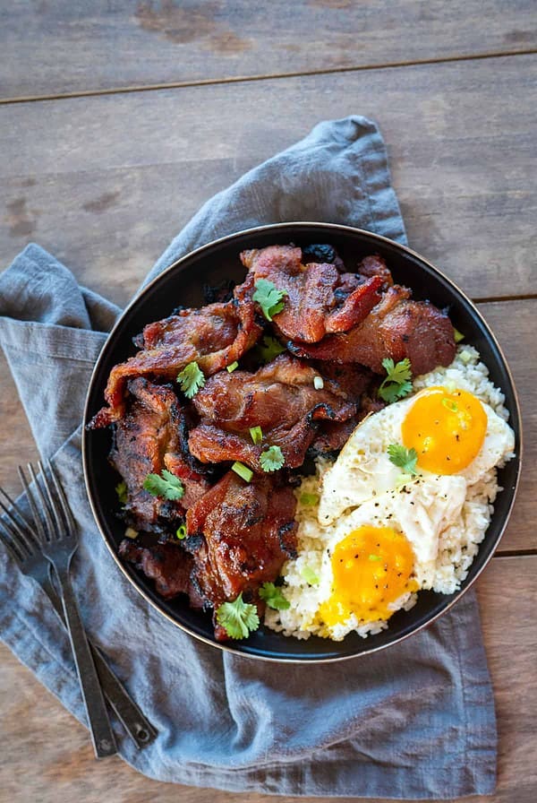 Plate of pork tocino with garlic fried rice and fried eggs.