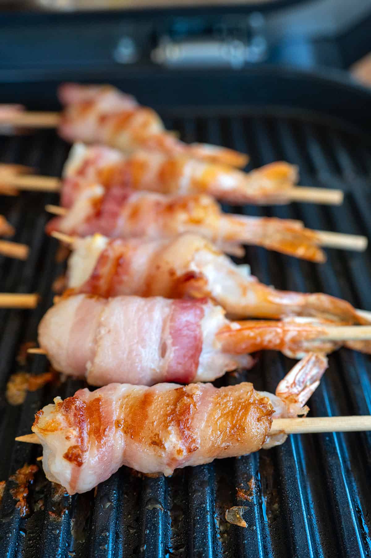 Bacon wrapped shrimp after grilling for 8 minutes.