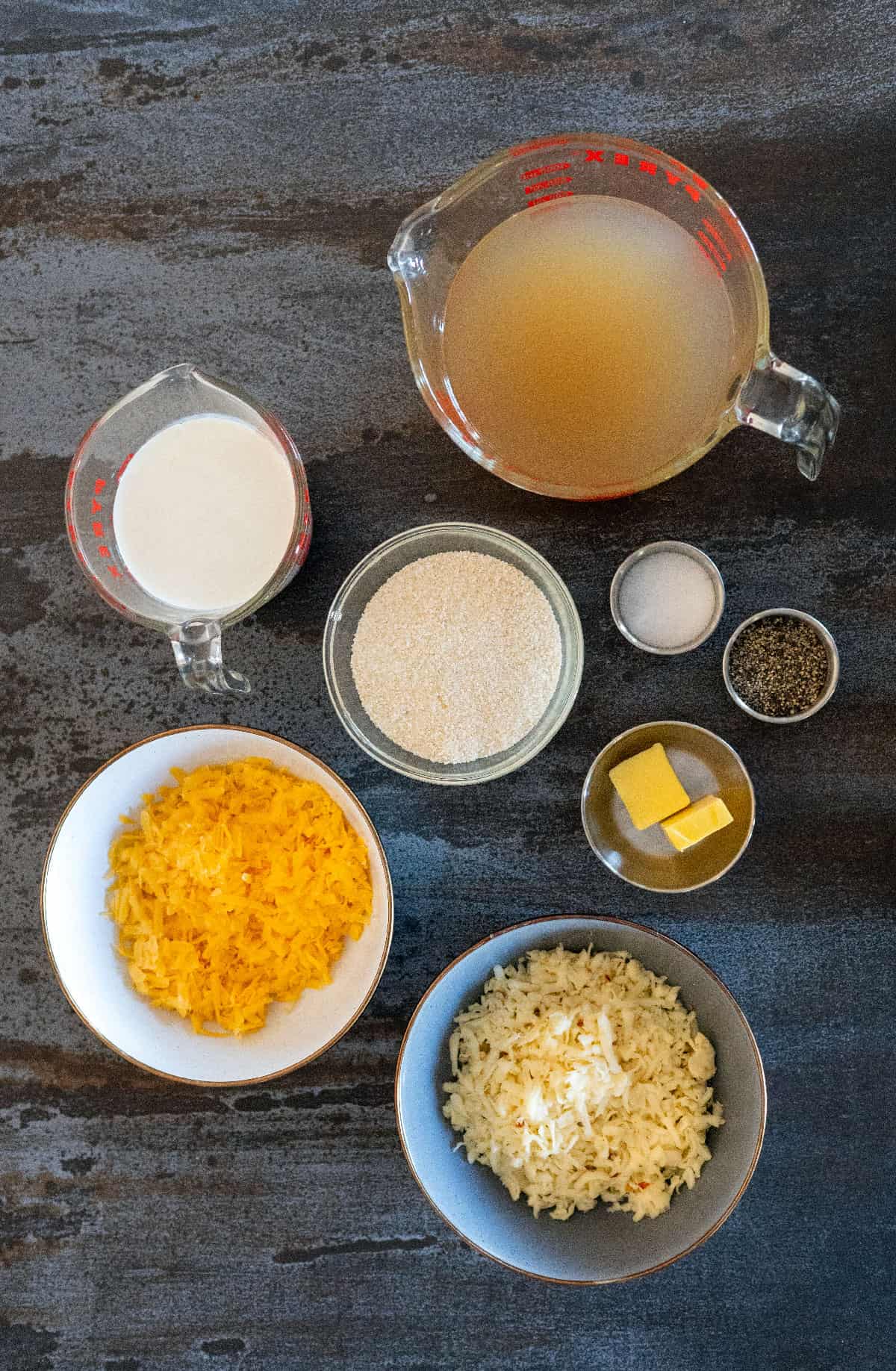 cheese grits ingredients: chicken broth, cream, grits, salt, pepper, butter, shredded cheeses.