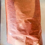 Brisket wrapped in butcher paper.