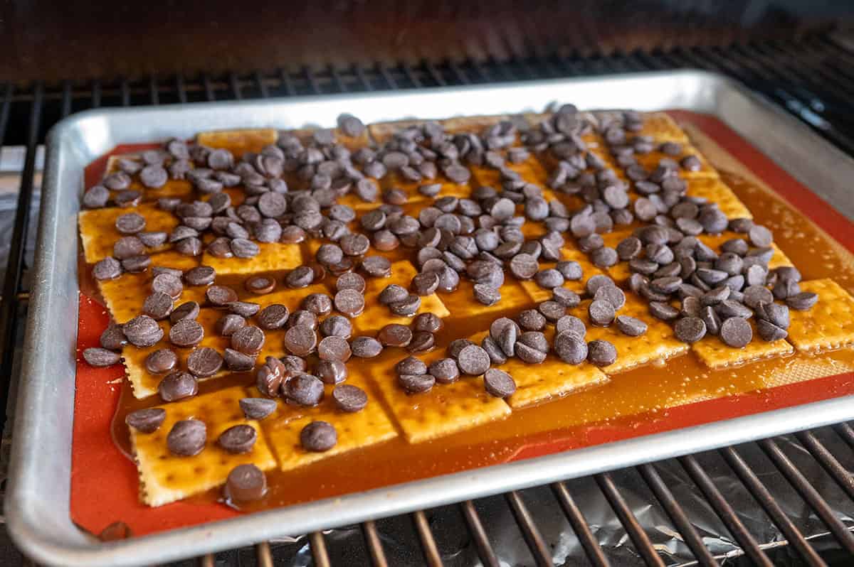 Chocolate chips sprinkled on toffee.