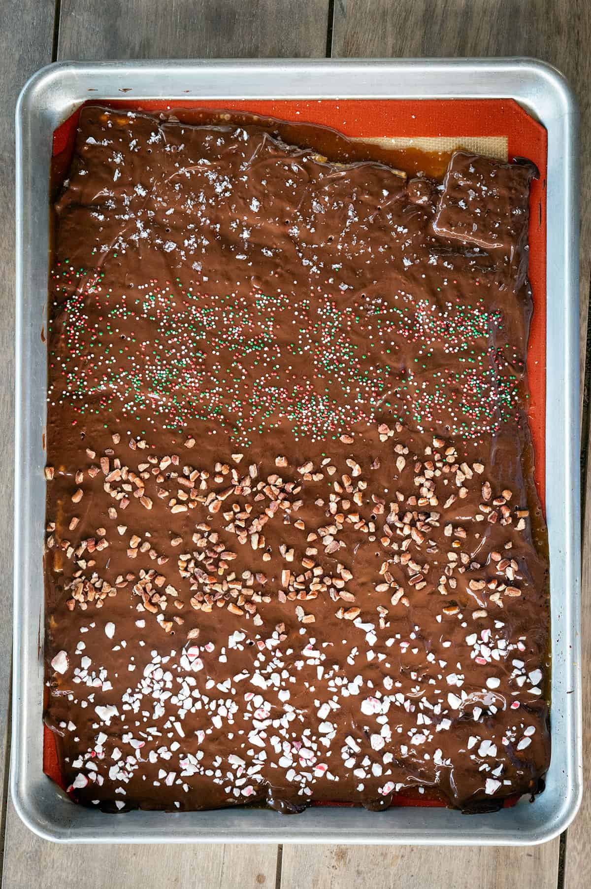 Pan of Christmas Crack with different toppings.