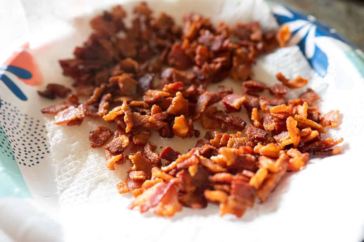 crispy bacon crumbles on paper towel.