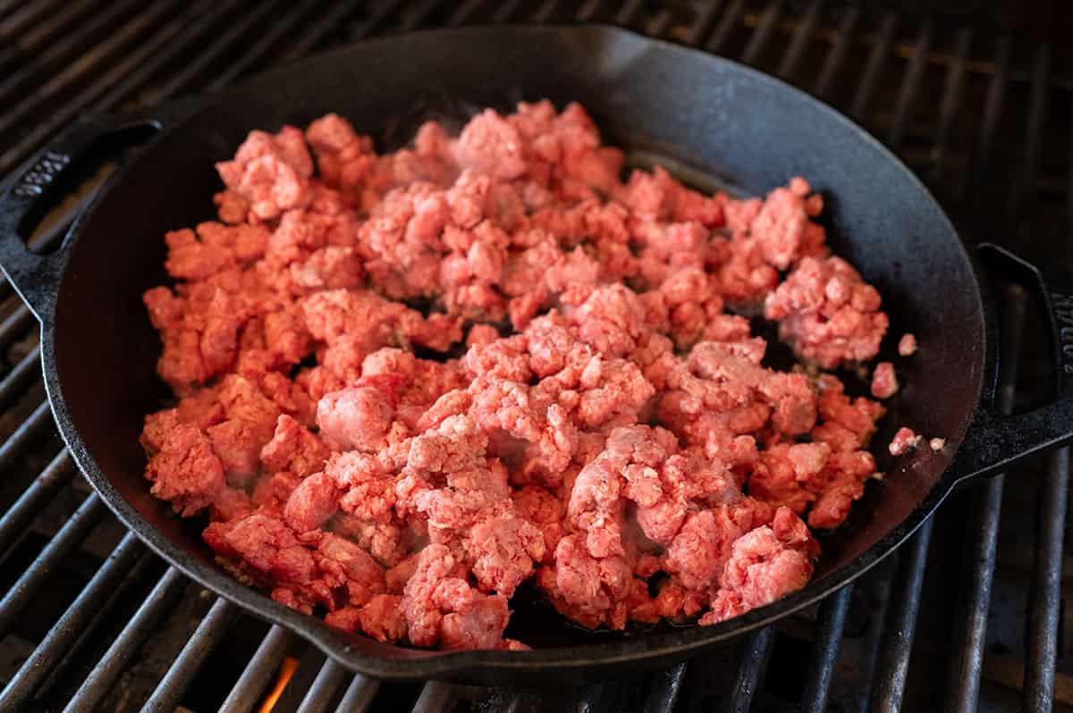 Raw ground beef in skillet.