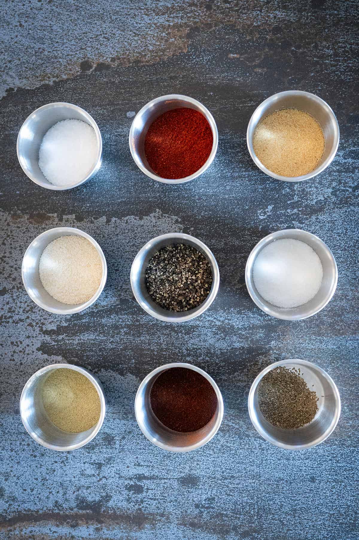 Bowls of spices used to make chicken wing dry rub. 