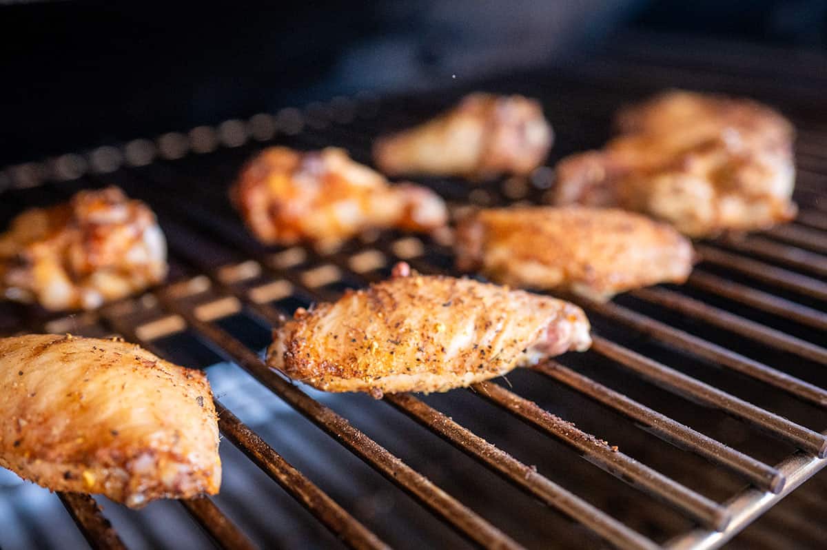 chicken wings grilling on a pellet grill.