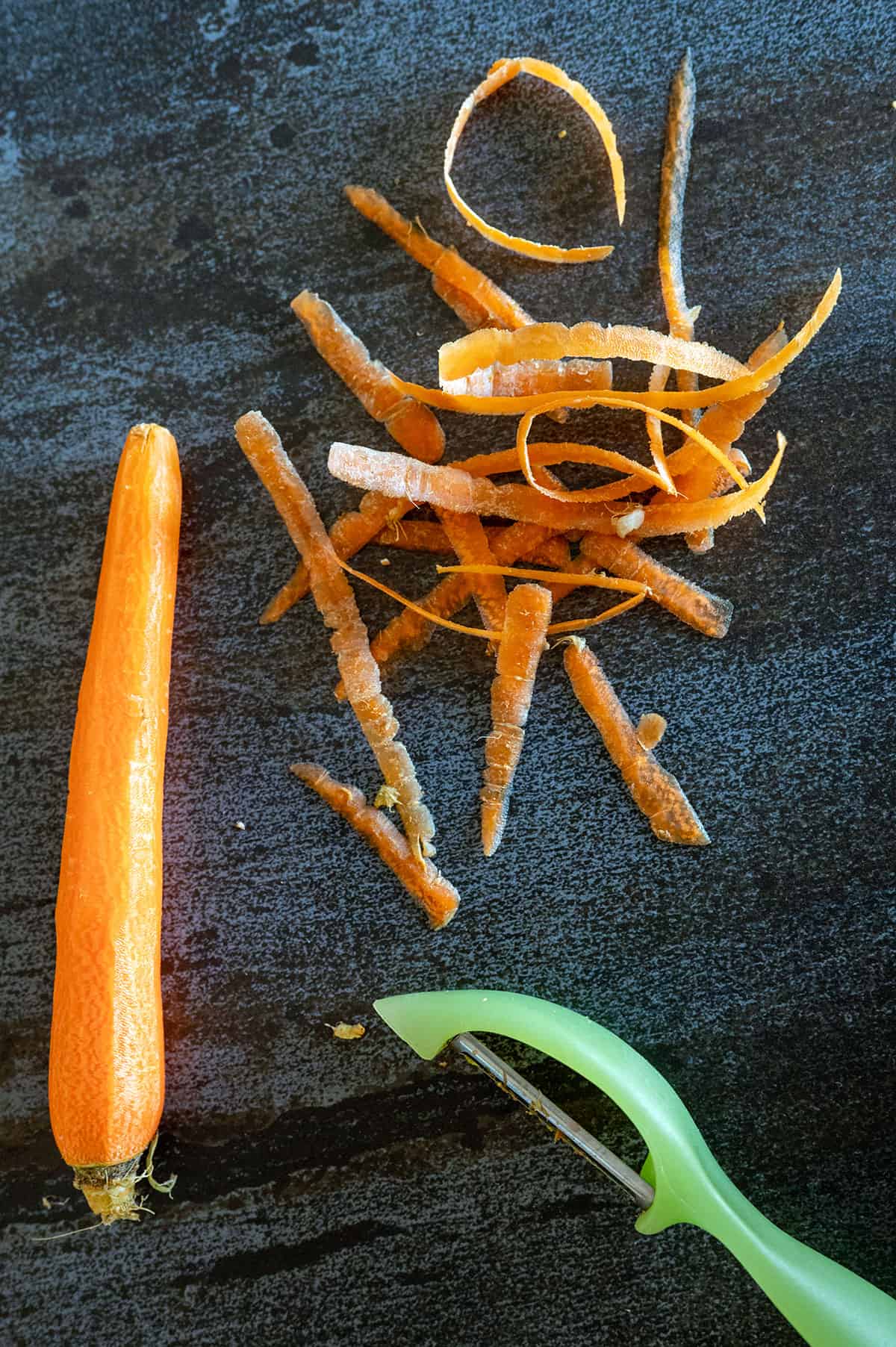 Peeling carrot.