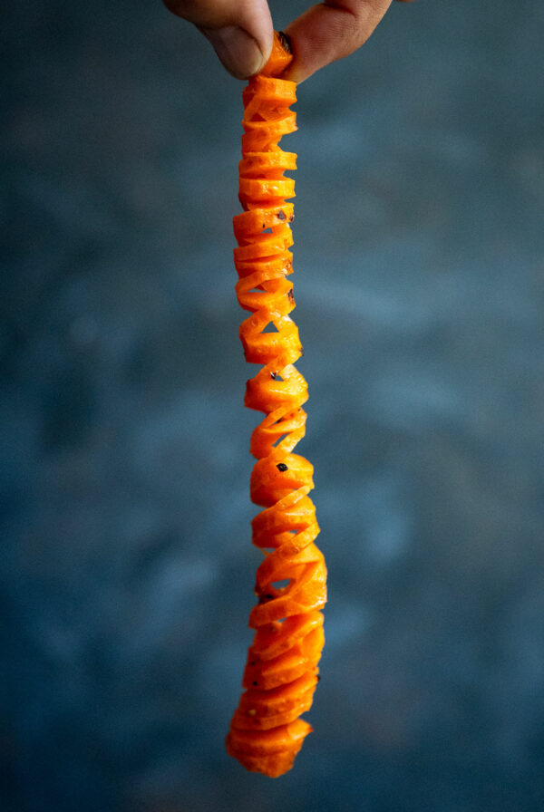 Holding spiral carrot.