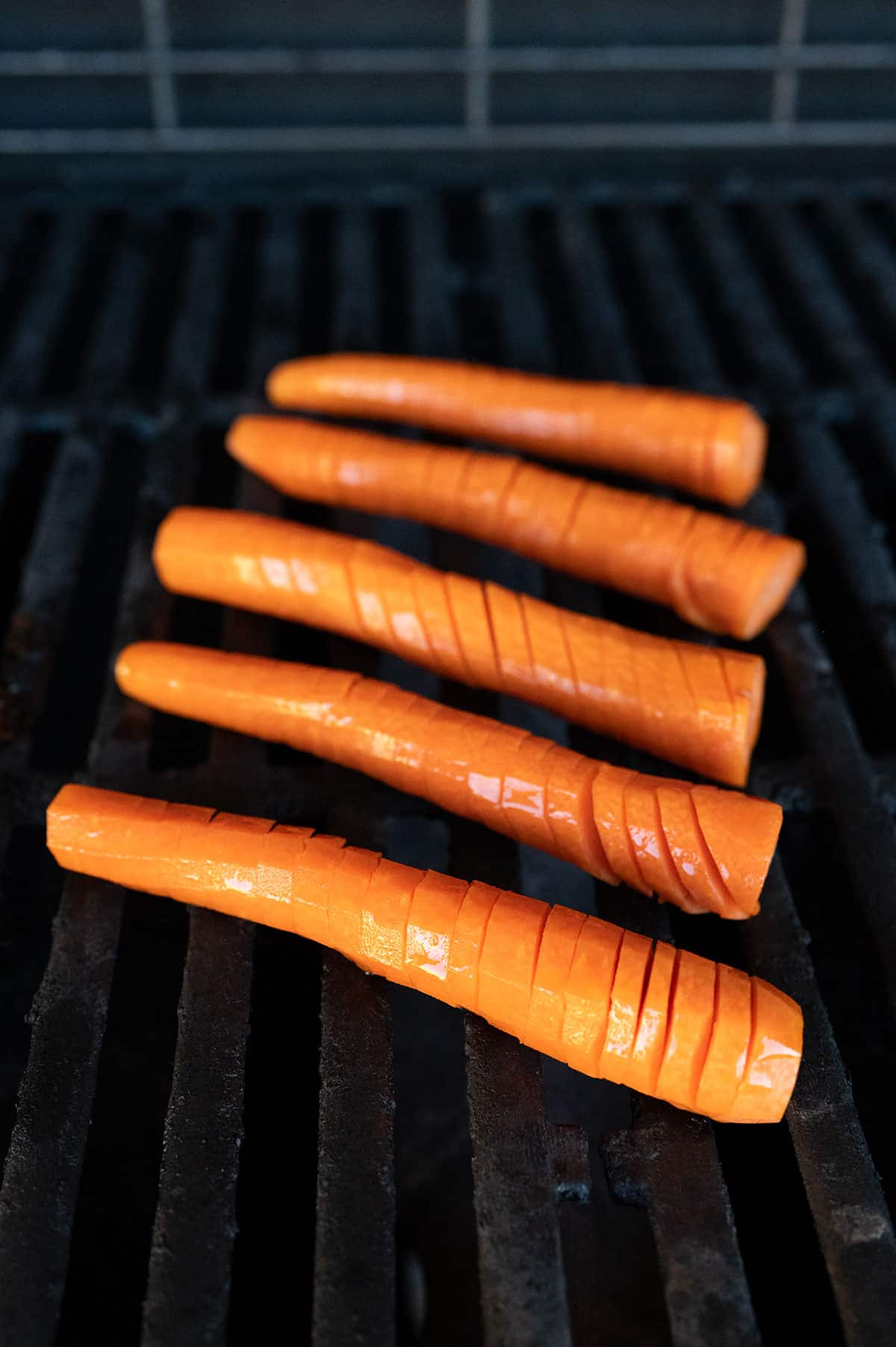 Spiral-cut carrots on grill.
