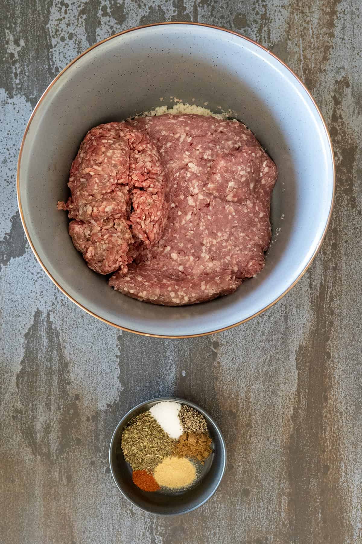 Bowl of meat and bowl of spices.