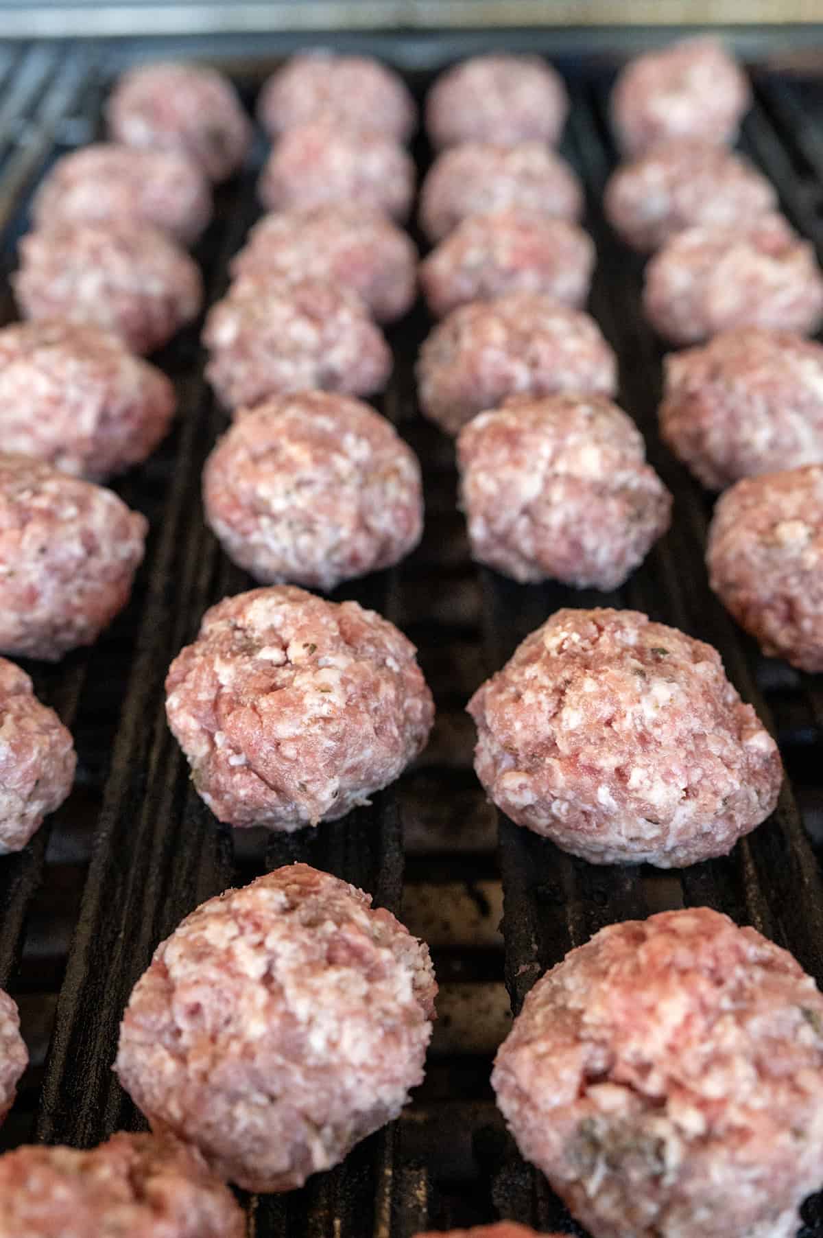 Meatballs on grill.