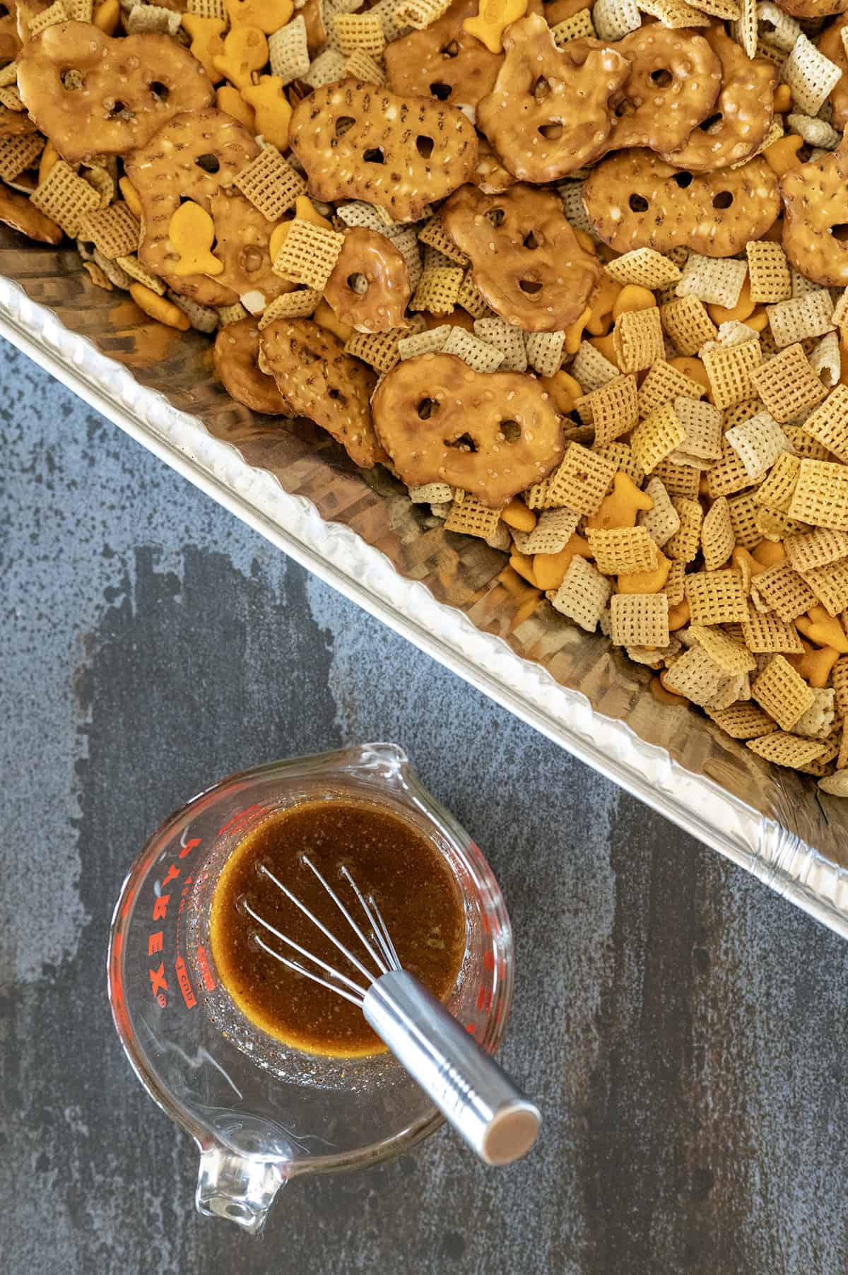 Mixing sauce for chex mix.