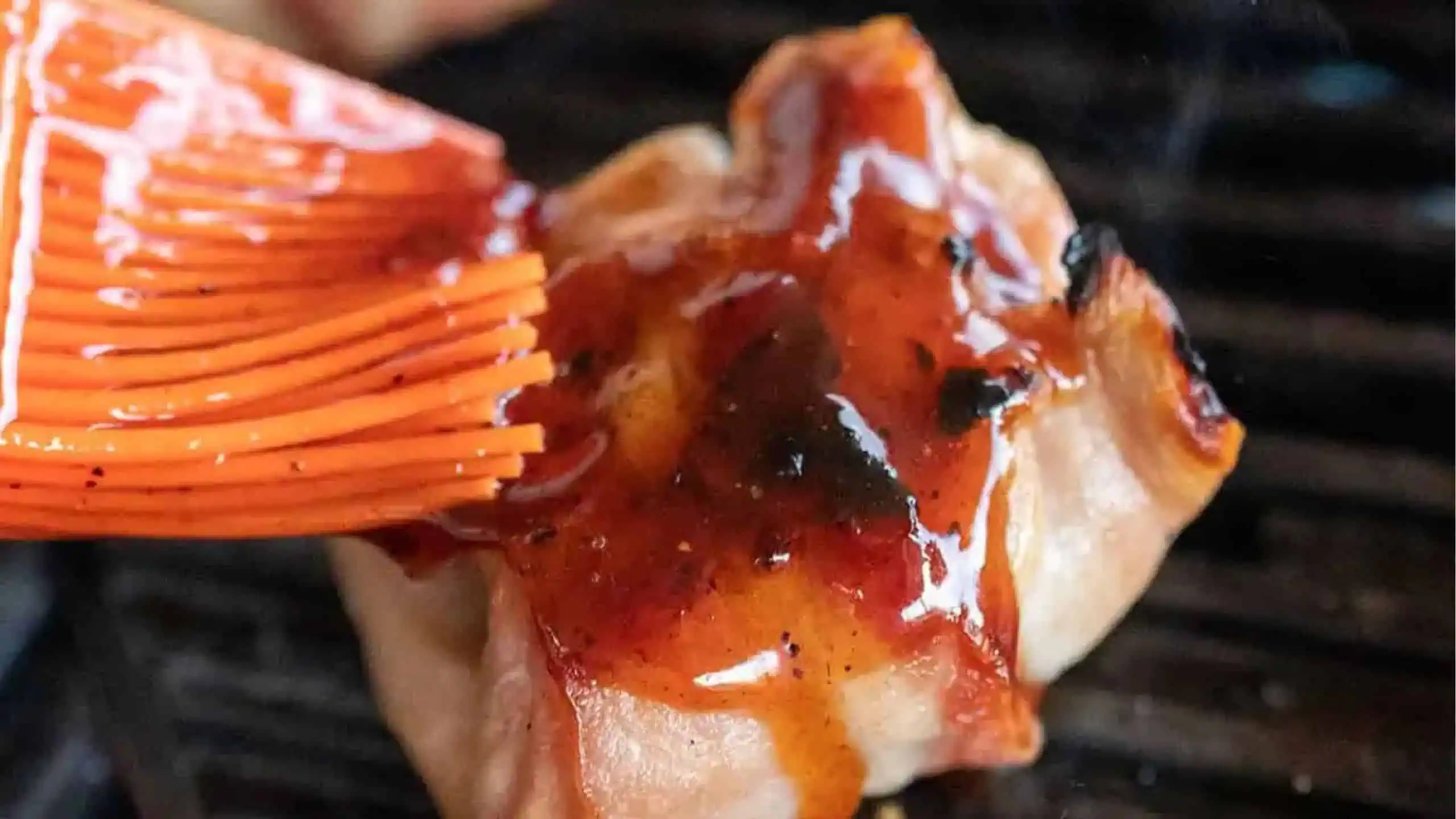 adding sauce to chicken.