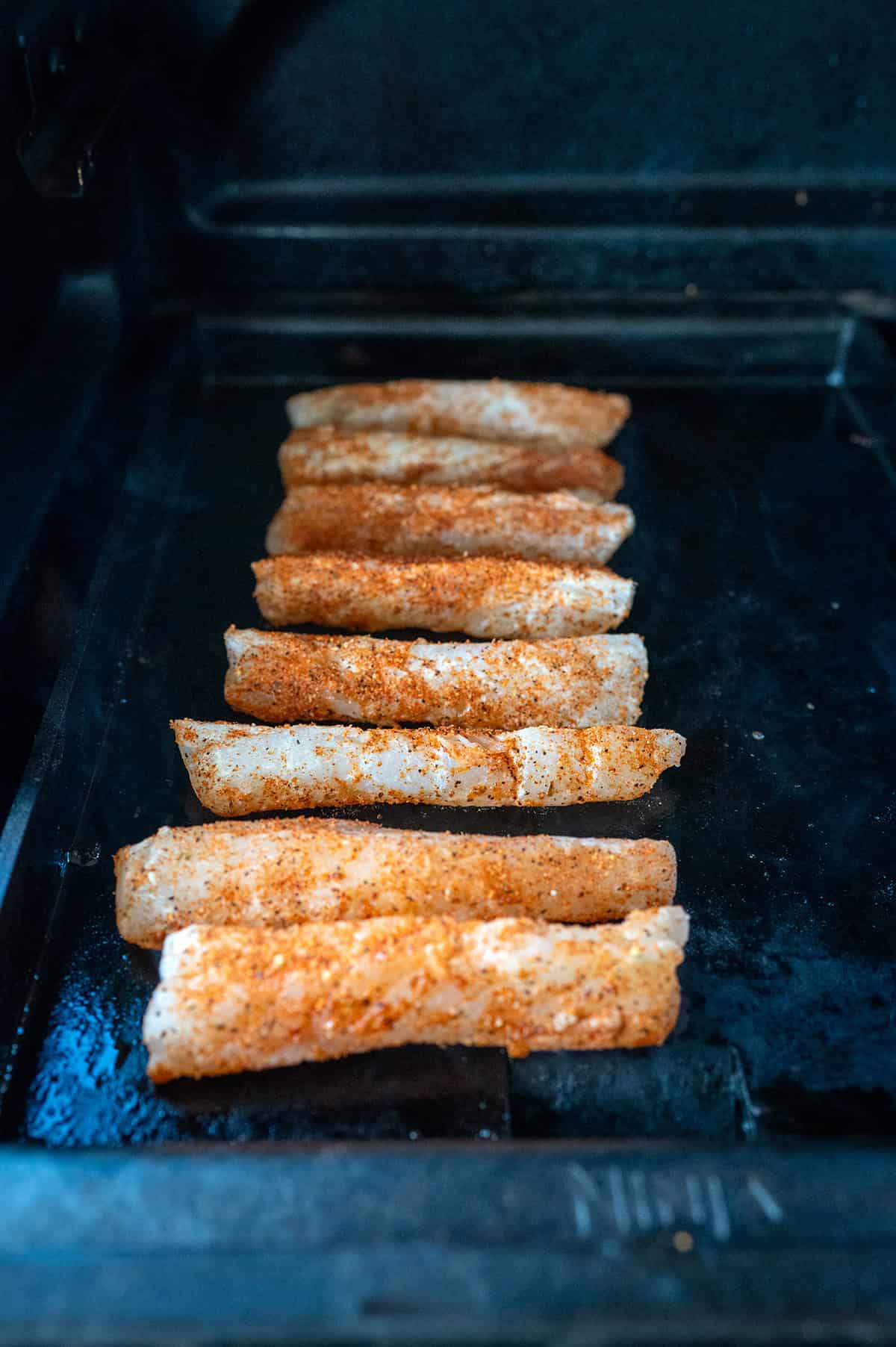 Fish tacos on griddle.