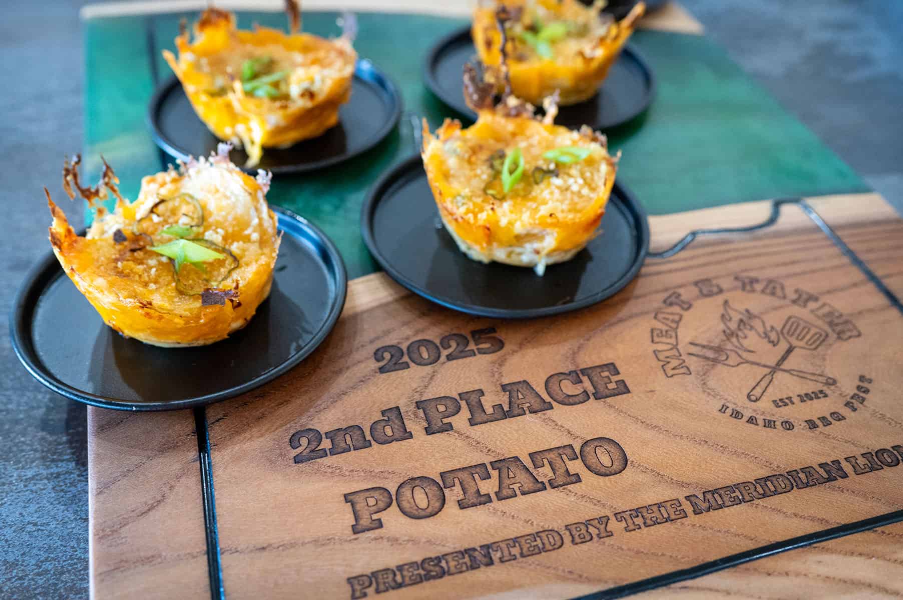 Potato stacks on 2nd place trophy.