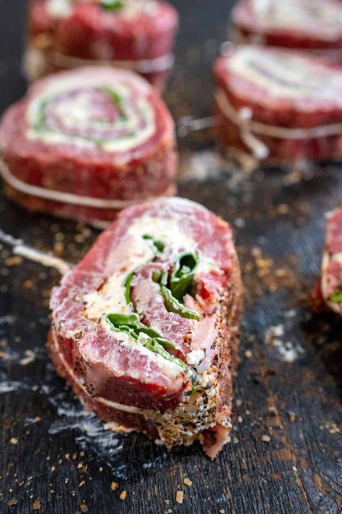 Sliced raw steak pinwheel.
