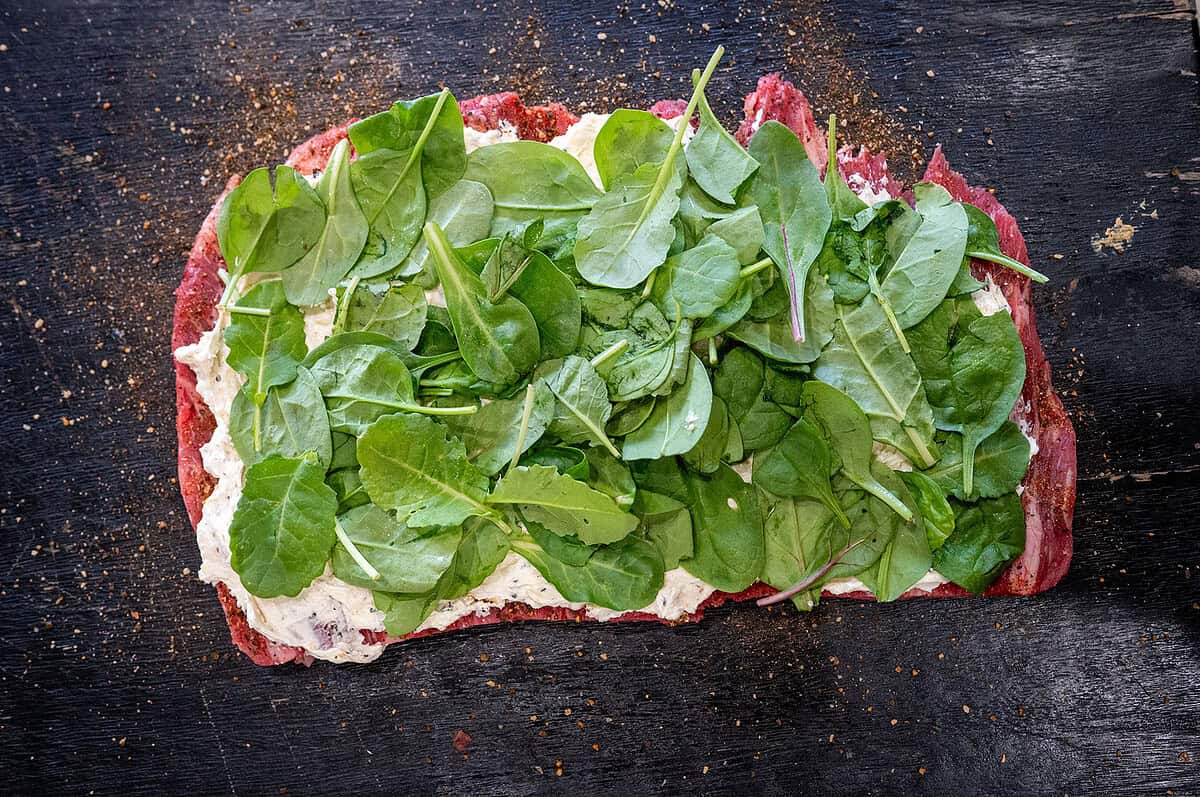 layer of spinach on cream cheese and steak.