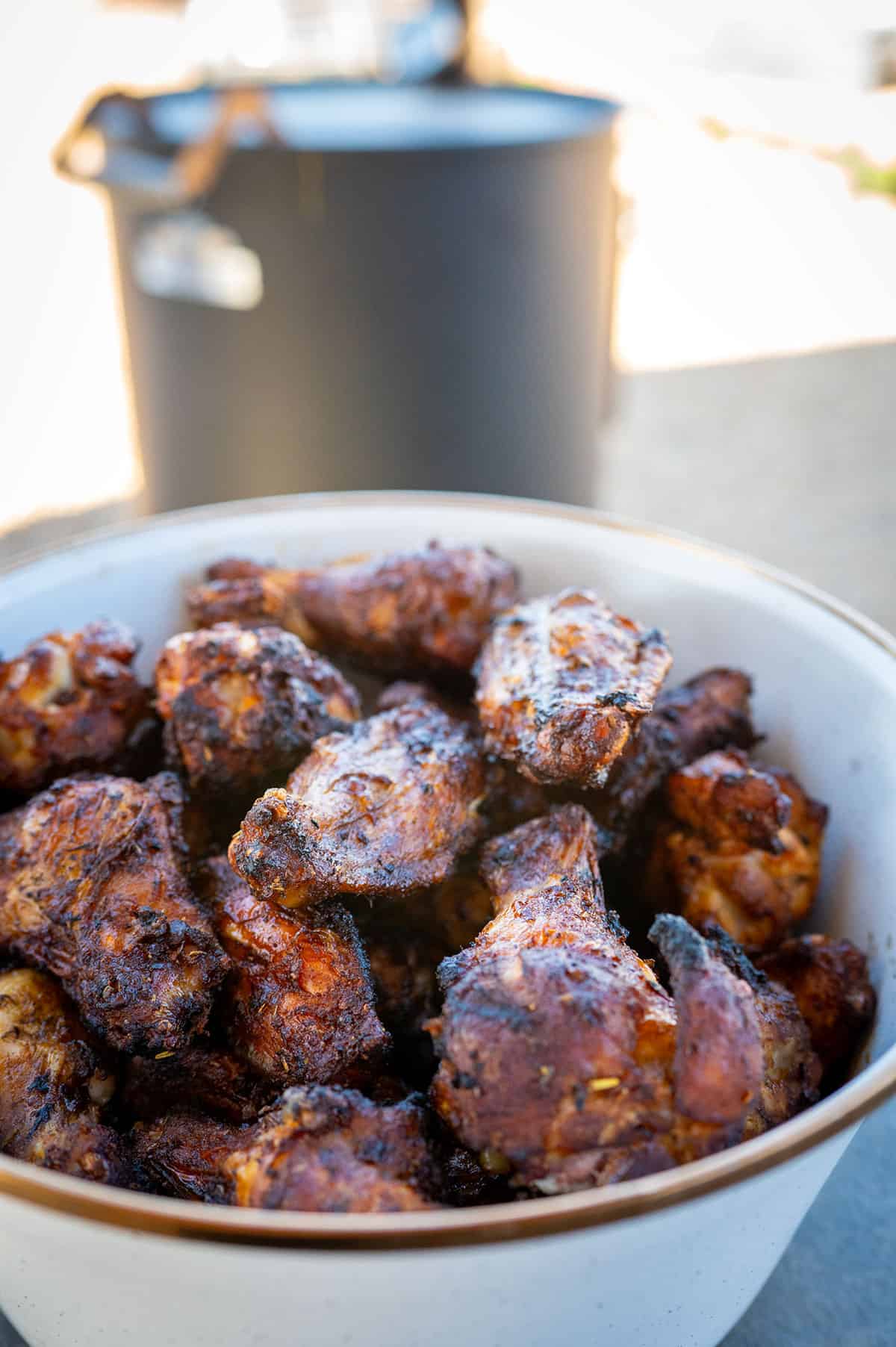 Bowl of wings smoked on a drum smoker.