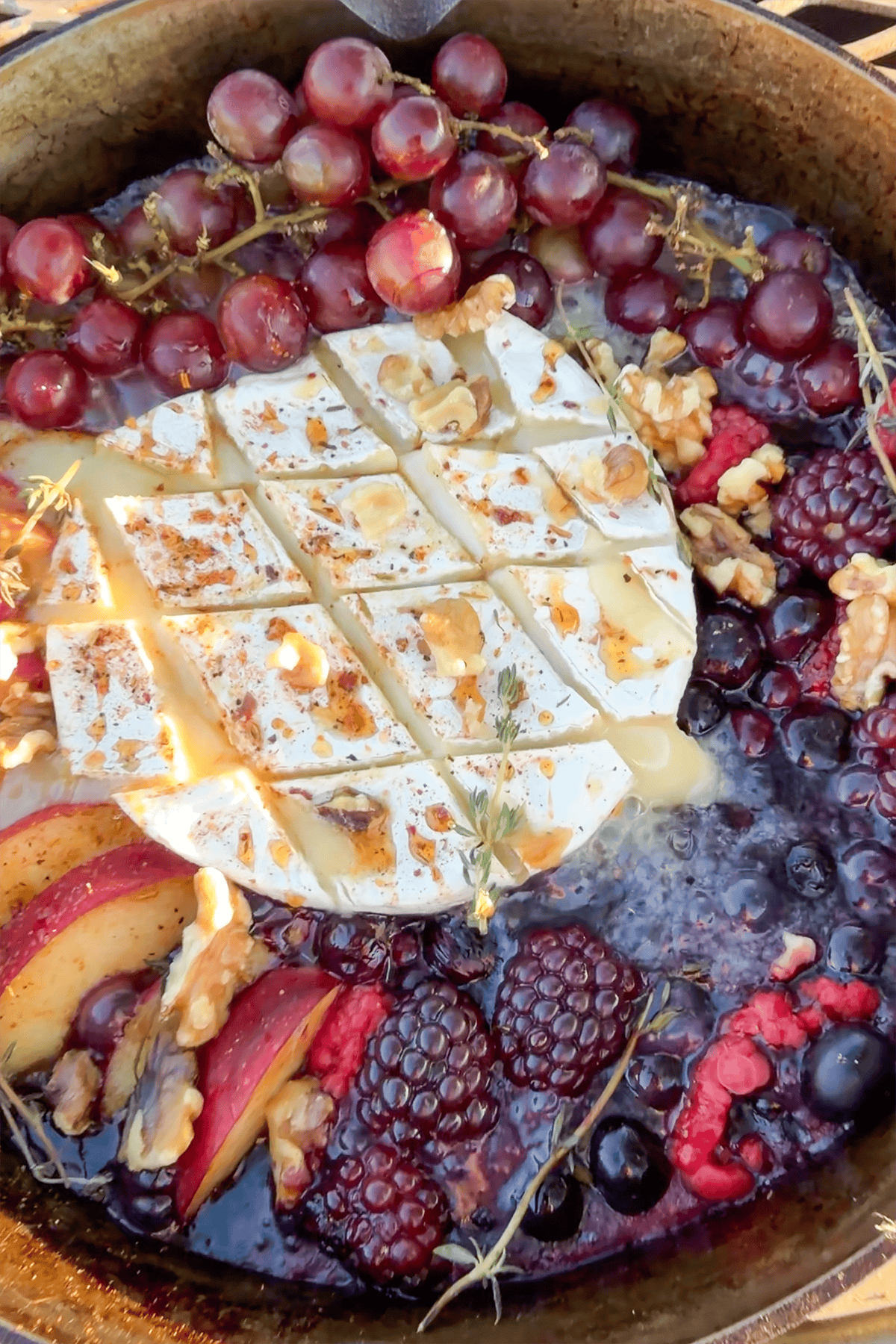 Brie cheese oozing out and berries sizzling.