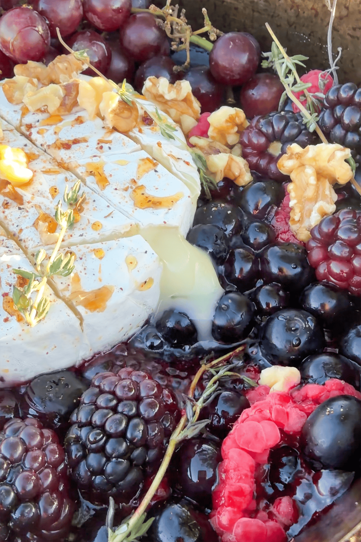 Brie cheese starting to ooze out of the rind.