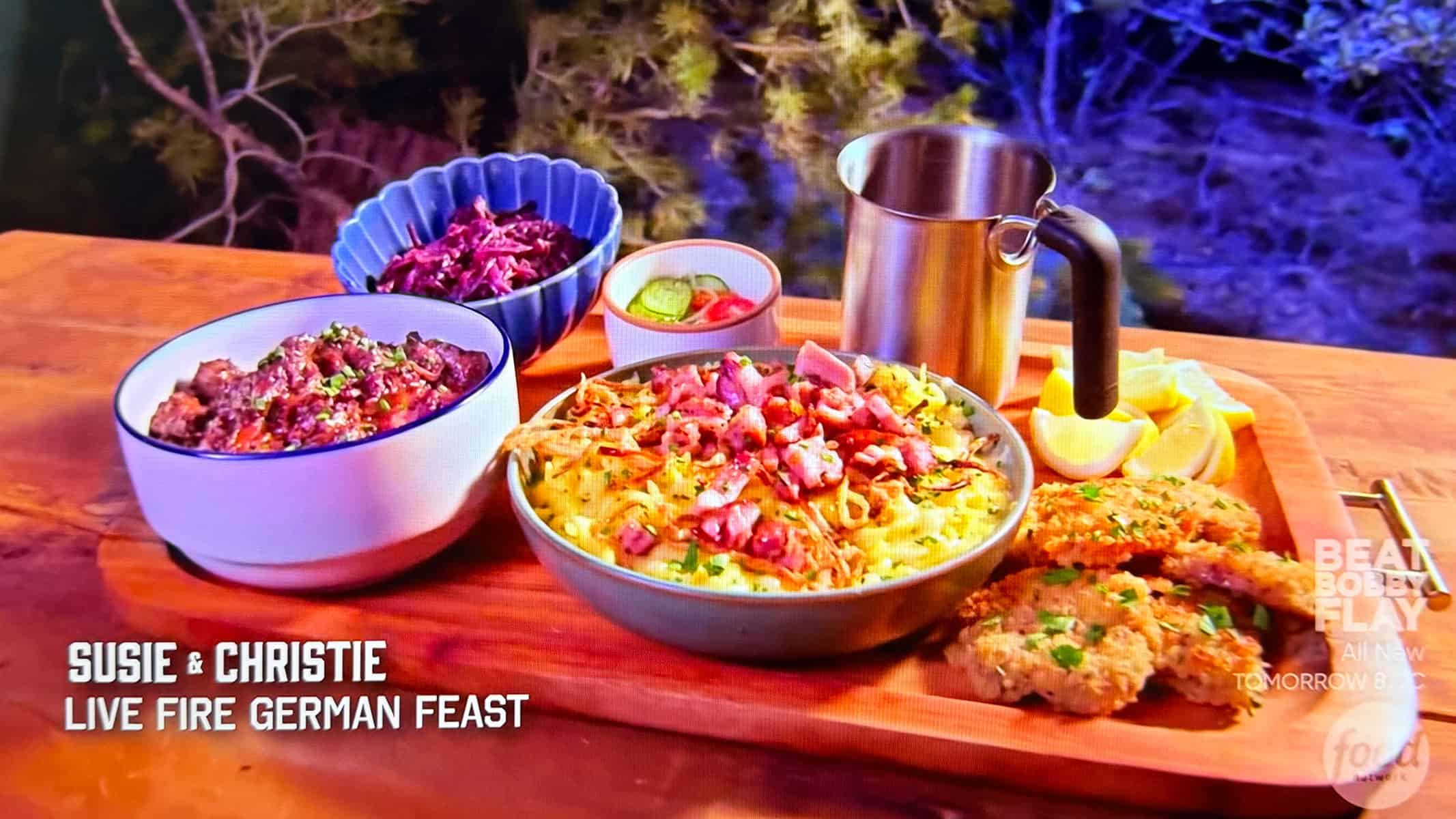 a platter of German dishes cooked over live fire on Pitmasters.