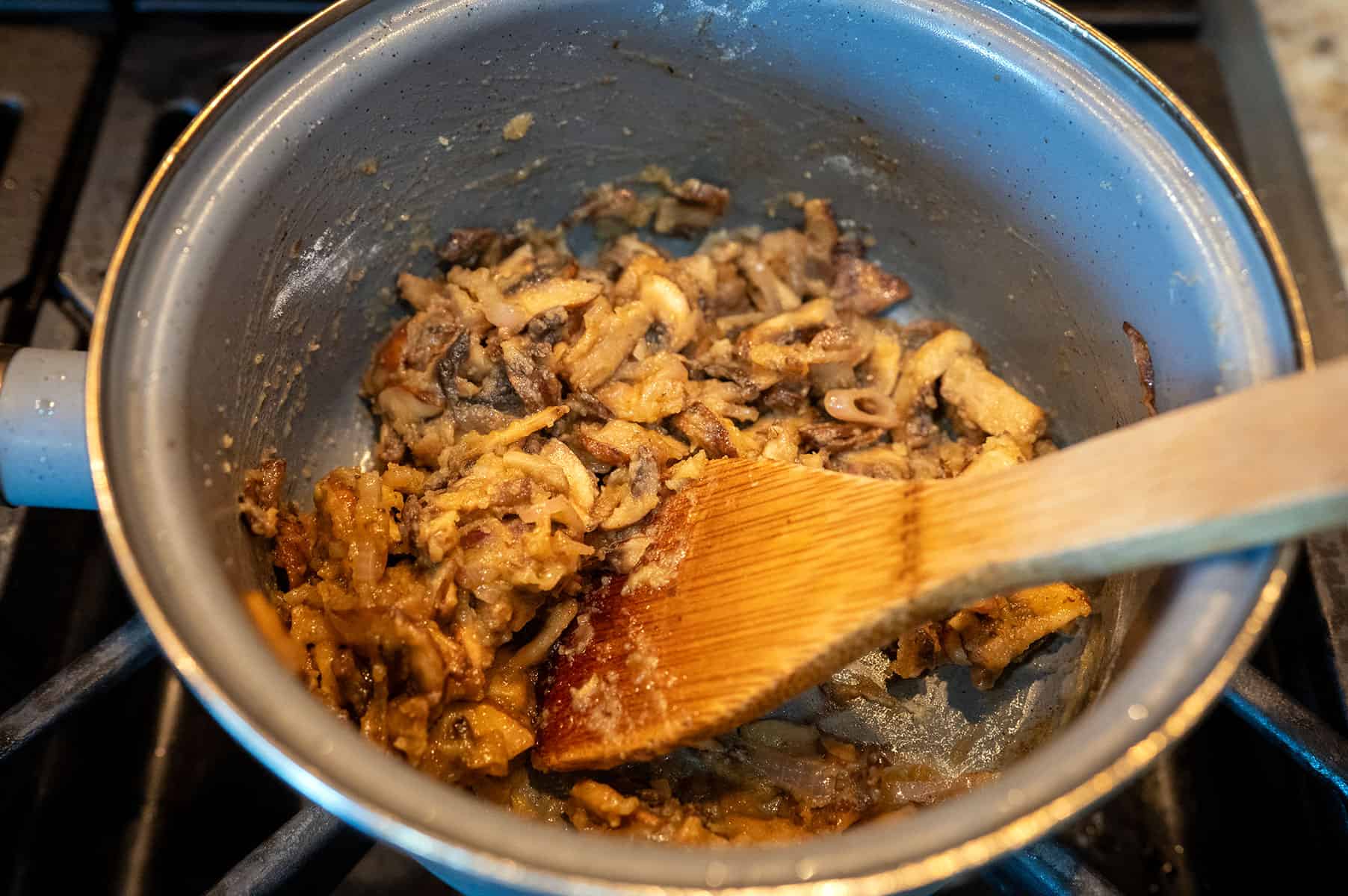 Making a roux with flour, mushrooms and shallots.